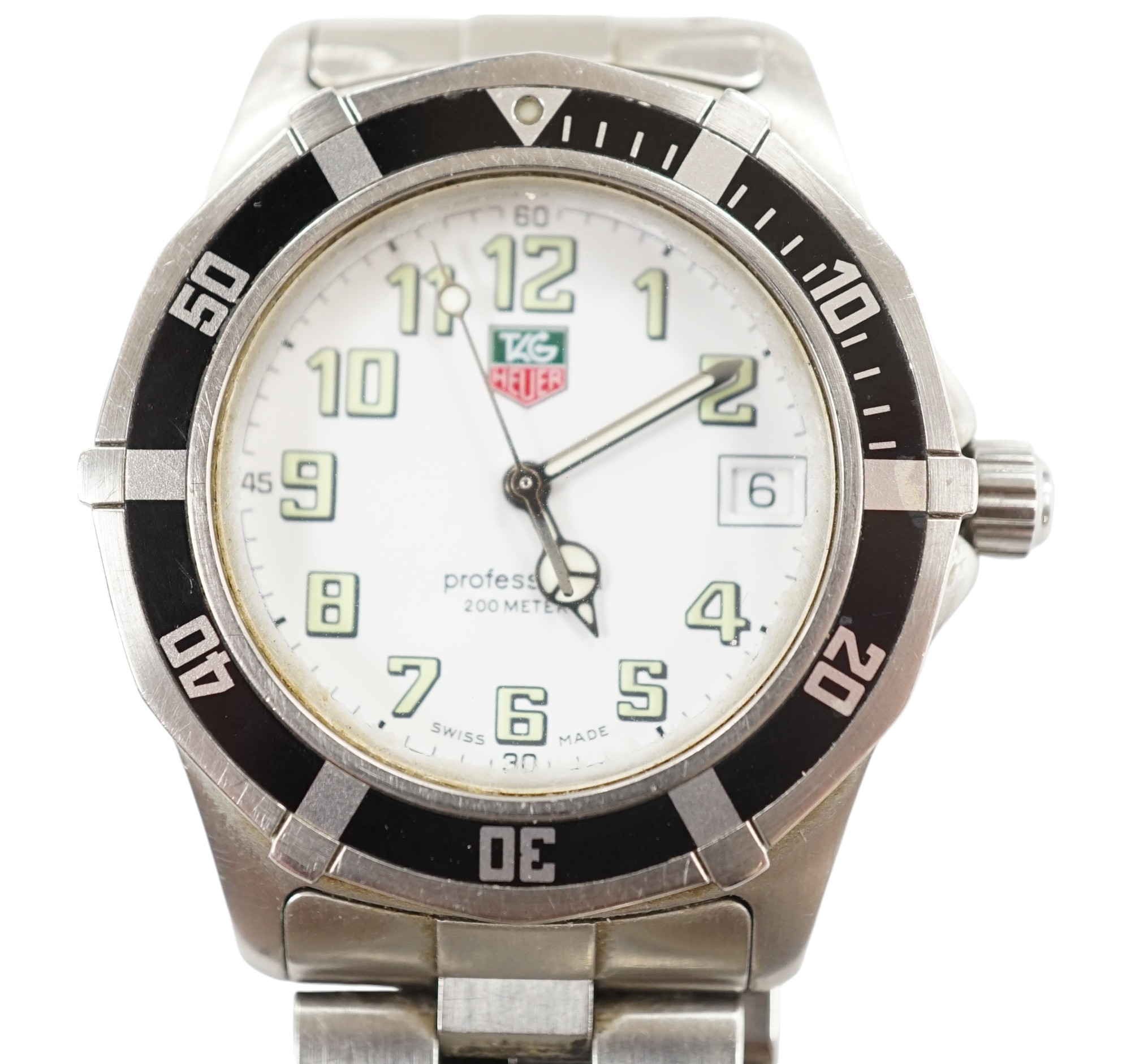 A gentleman's recent stainless steel Tag Heuer Professional quartz wrist watch, no box or papers. Condition - poor to fair